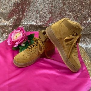 High top Nike air forces (boys grade school).